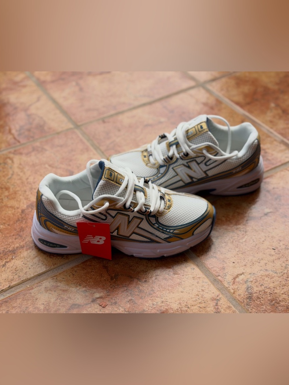 Size 7 Men’s And 8.5 Women’s - New Balance 740 White and Gold Mesh Lace-Up